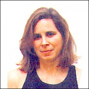 Monica Drum Woman with shoulder-length brown hair